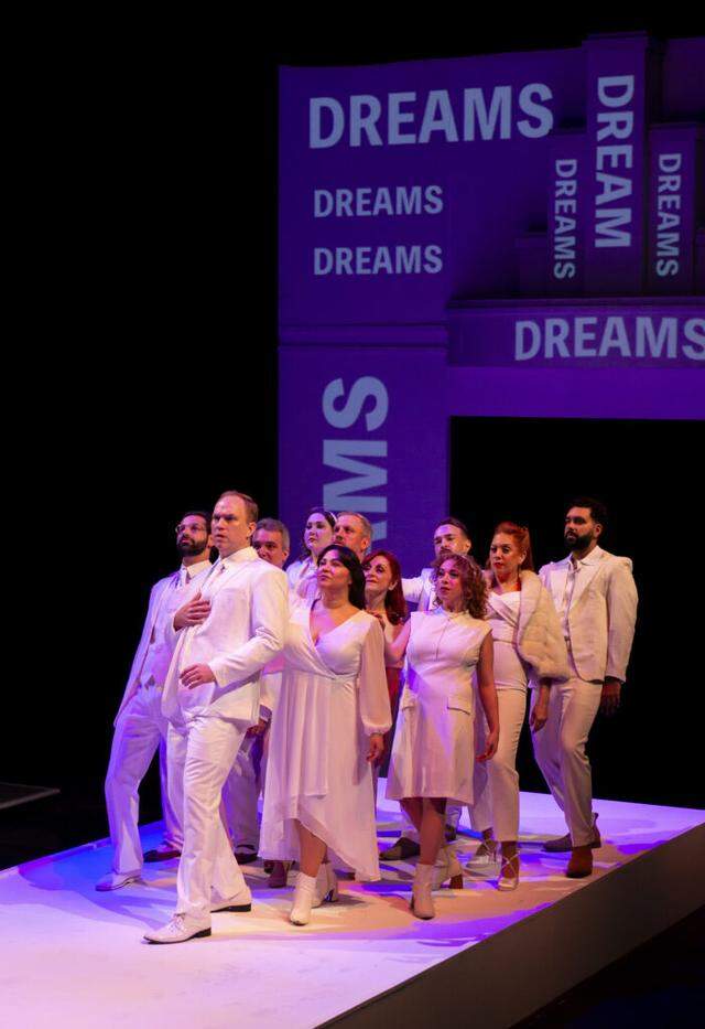 Jacob Brown’s scenic design consists of a long stage and Steve Covey’s projections. )