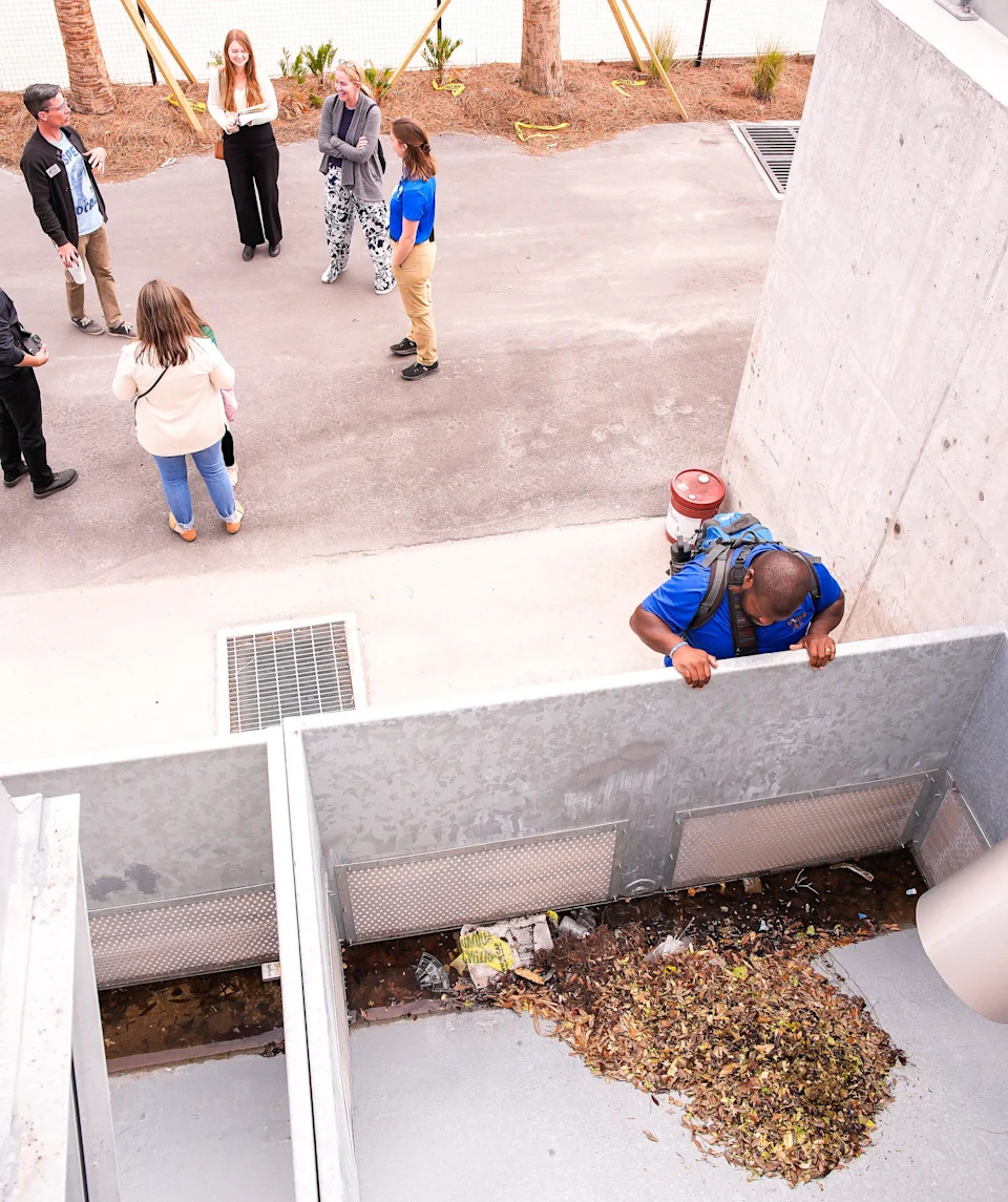 Alex Troutman, a biologist with N8ture Al out of Atlanta, Ga., checks out the processed waste of the manatees at the $72 million J. Wayne and Delores Barr Weaver Manatee River Habitat and VyStar SkyScape Entrance Tuesday March 3, 2026 at the Jacksonville Zoo and Botanical Gardens in Jacksonville, Fla. [Doug Engle/Florida Times-Union]