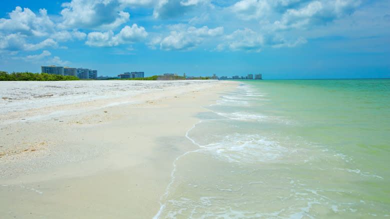 A view of Tigertail Beach with buildings in the background