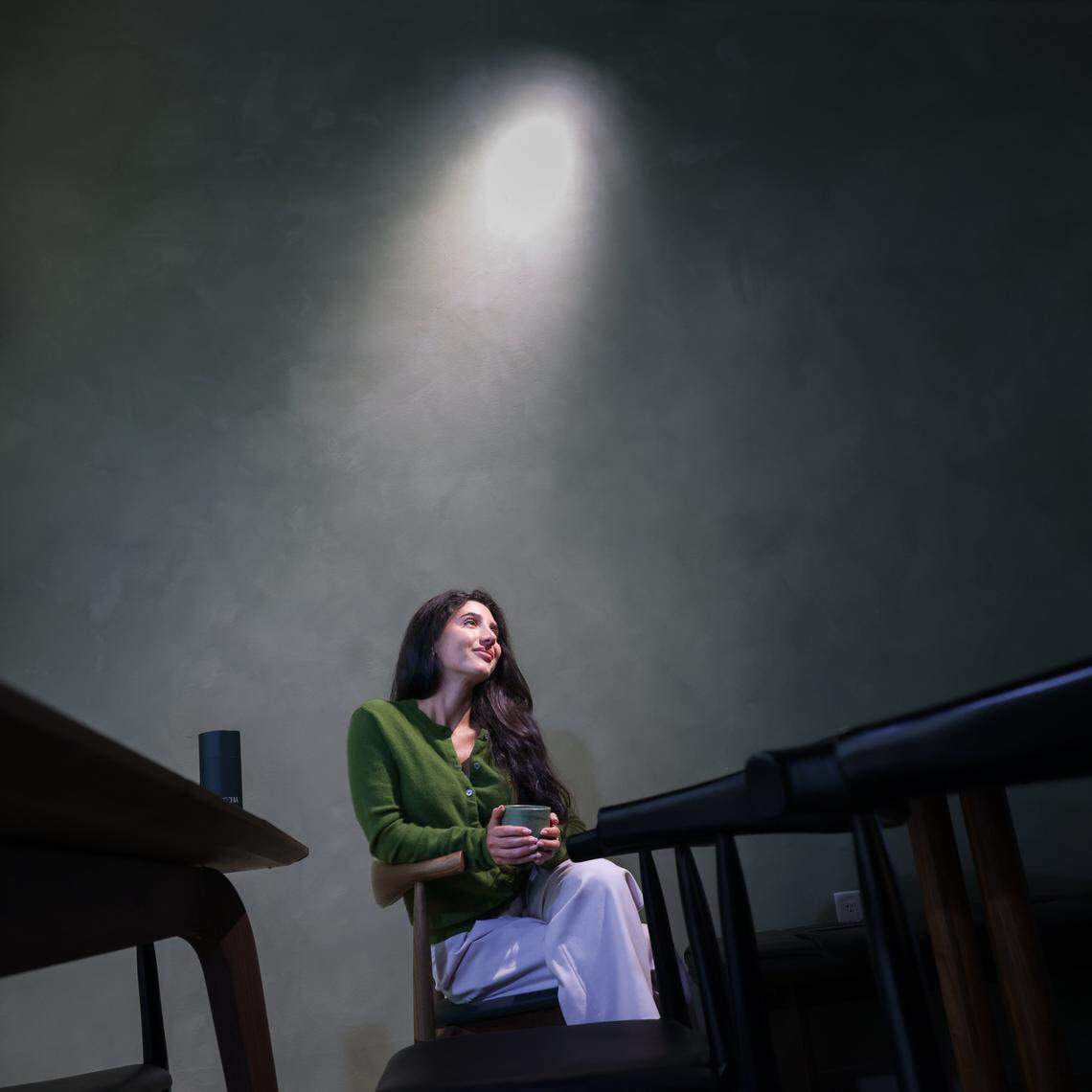 Alma Matcha co-owner Taymir Terrell, 28, takes a moment as she enjoys her business new location at the Thrive Art District.