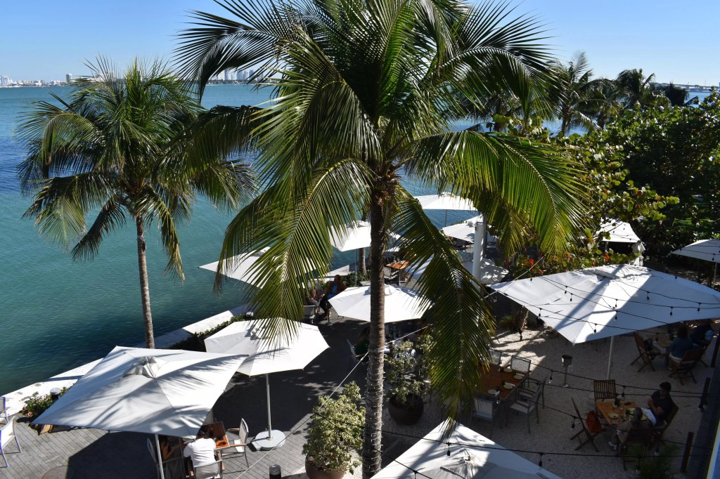 A dining area by a body of water