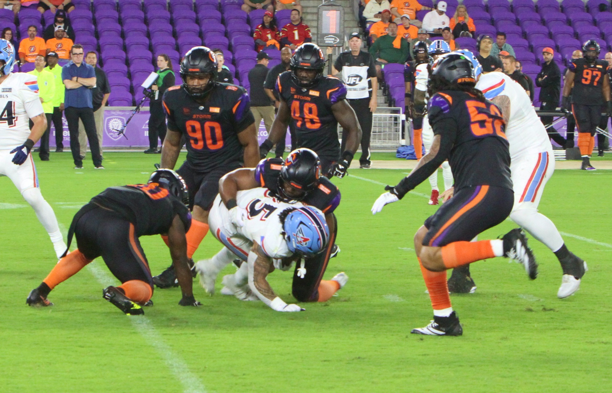 Orlando Storm linebacker Andrew Parker tackles Columbus Storm running back...