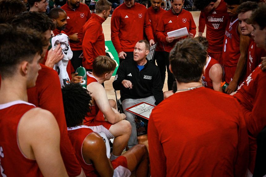 Miami (Ohio) head coach Travis Steele talks to his team during the second half of a game at Marshall last month.