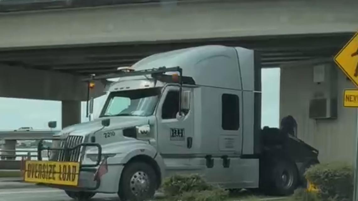 Semi-truck gets stuck under bridge on Bayshore Boulevard