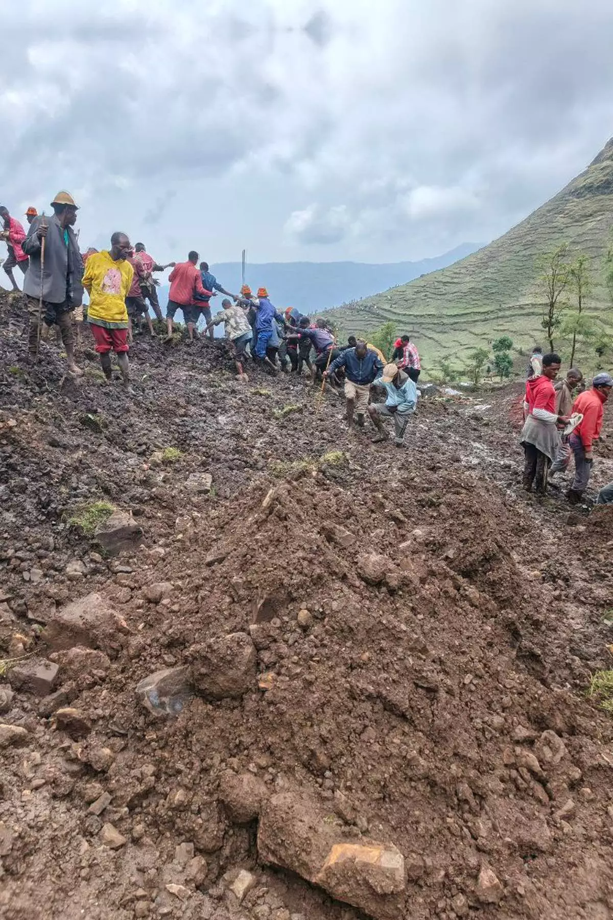 Locals search for the bodies of mudslide victims in the Gacho Baba district of the Gamo Zone in southern Ethiopia on Tuesday, March 10, 2026. (Gacho Baba District Government Communication Affairs Department via AP)
