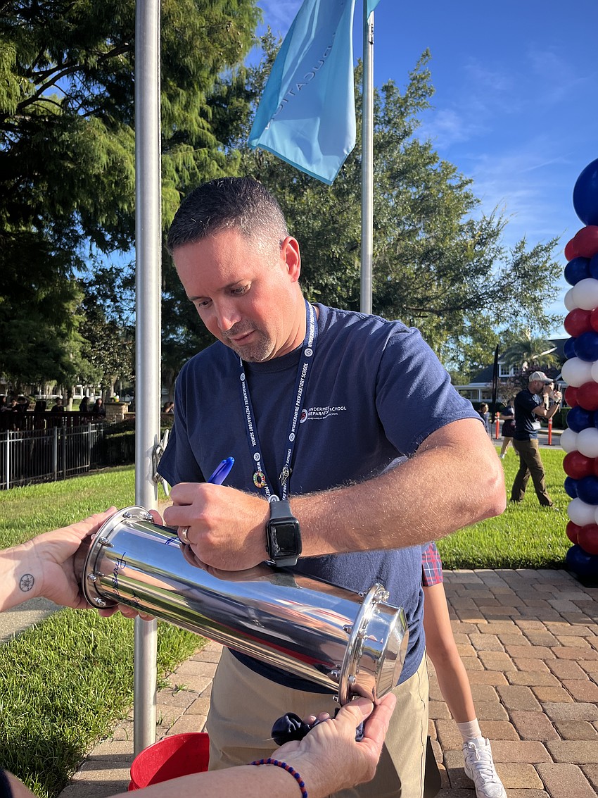 As the new head of school at Windermere Preparatory School, Alex Birchenall wants to honor the history of the school while guiding it into the future. He signed the time capsule buried as part of the school’s 25th anniversary festivities.