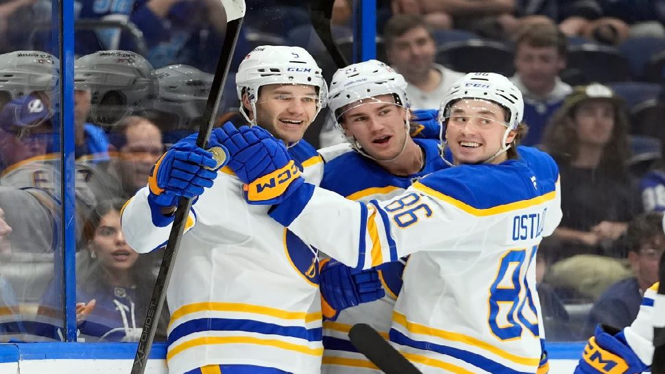 Buffalo Sabres defenseman Rasmus Dahlin, left, celebrates his goal against the Tampa Bay Lightning with right wing Jack Quinn, right, during the first period of an NHL hockey game Saturday, Feb. 28, 2026, in Tampa, Fla. (AP Photo/Chris O'Meara)