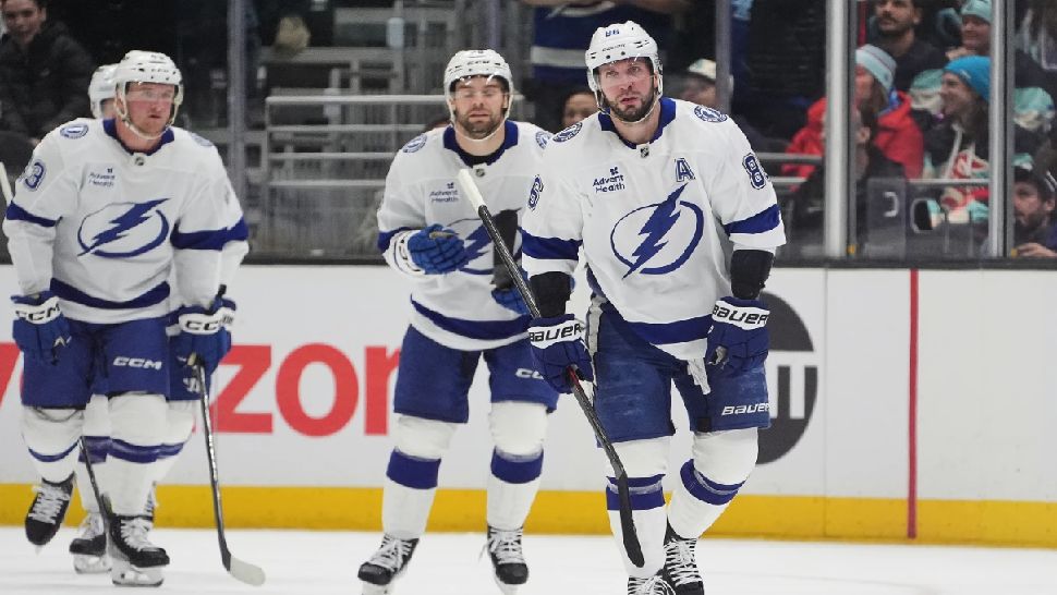Tampa Bay Lightning right wing Nikita Kucherov skates to greet the bench after scoring against the Seattle Kraken during the first period of an NHL hockey game Tuesday, March 17, 2026, in Seattle. (AP Photo/Lindsey Wasson)