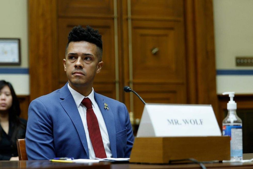 brandon wolf sitting in congressional hearing room