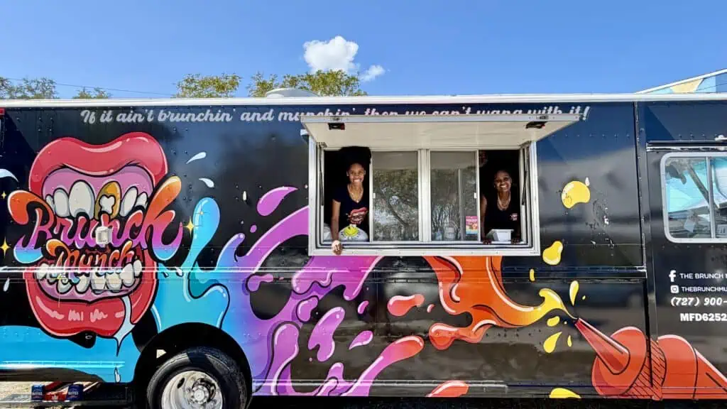 Two people on a food truck