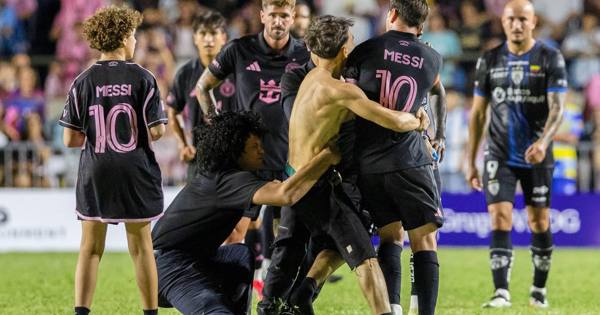 Lionel Messi knocked down after fans storm pitch during Inter Miami friendly in Puerto Rico