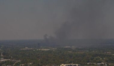 Junkyard car fire causing massive plume of smoke west of Downtown Jacksonville