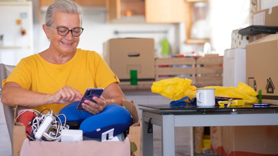 A woman packs her things as she gets ready for a move.
