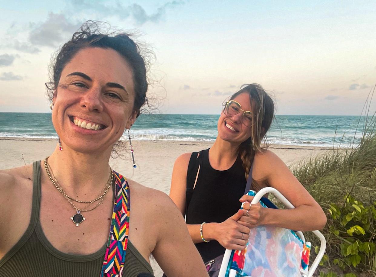 The author standing with her sister on a Fort Pierce beach.