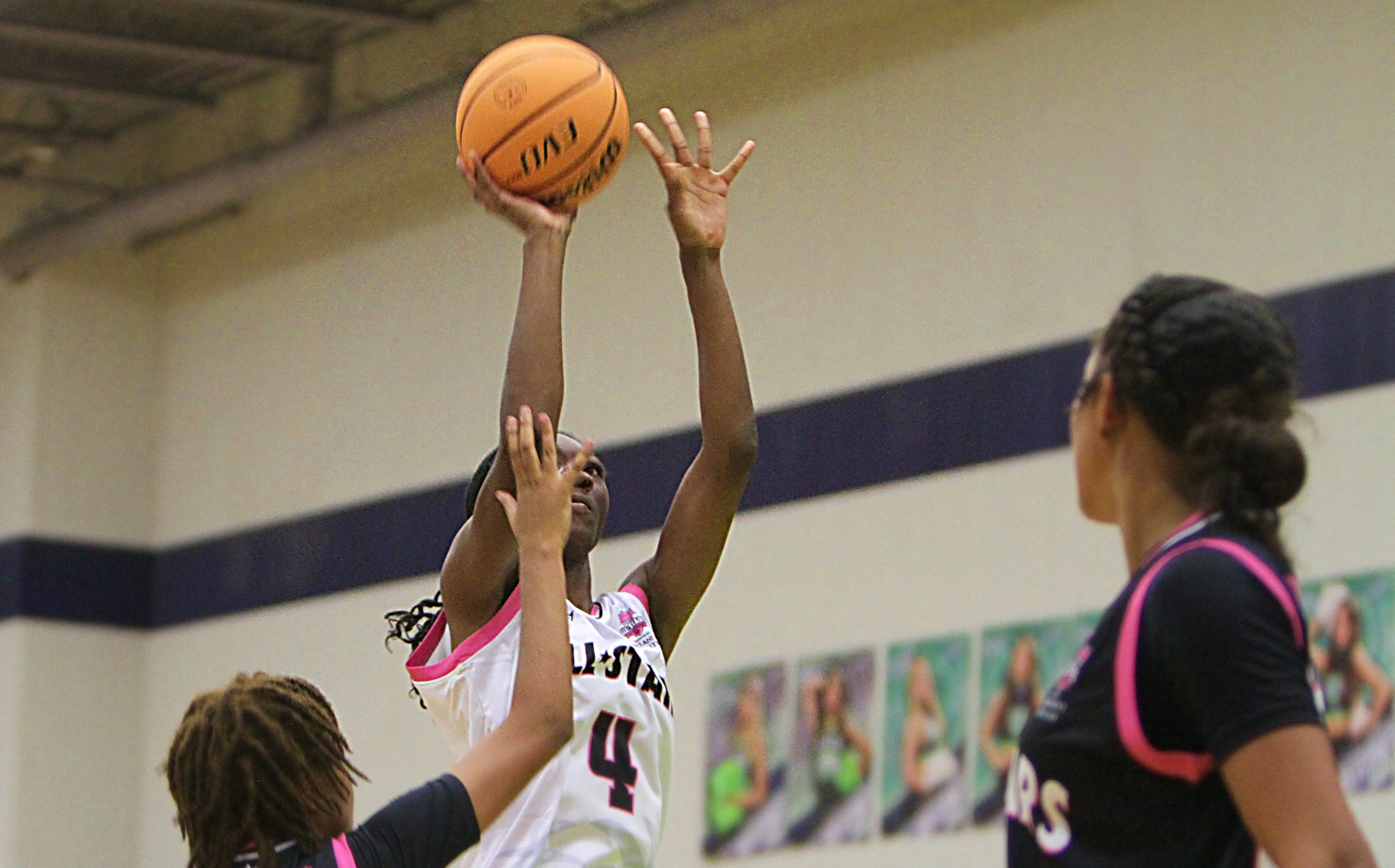 Naima Durandisse shoots over defenders for 2 of her 8...