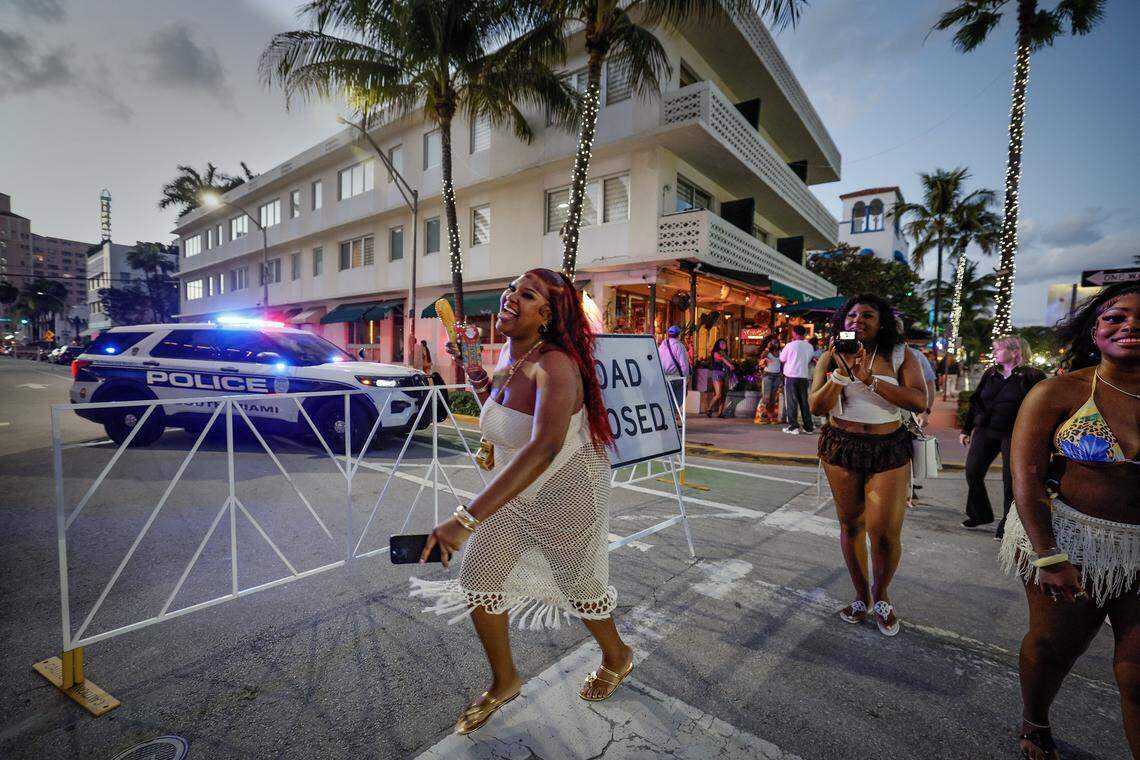 Traneicia Johnson, a student at Palm Beach State College, crosses Eighth Street on Ocean Drive with her friends, Naomi Cadet of FSU and Day Cooper of FAMU, seen left to right, during spring break on South Beach, Friday, March 20, 2026.