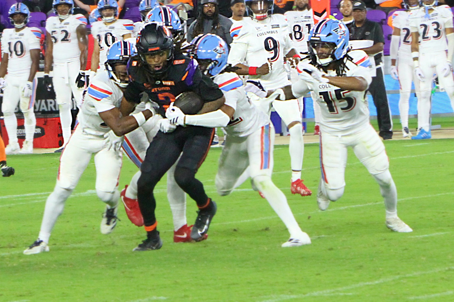 Orlando Storm receiver Elijhah Badger is brought down by Columbus...