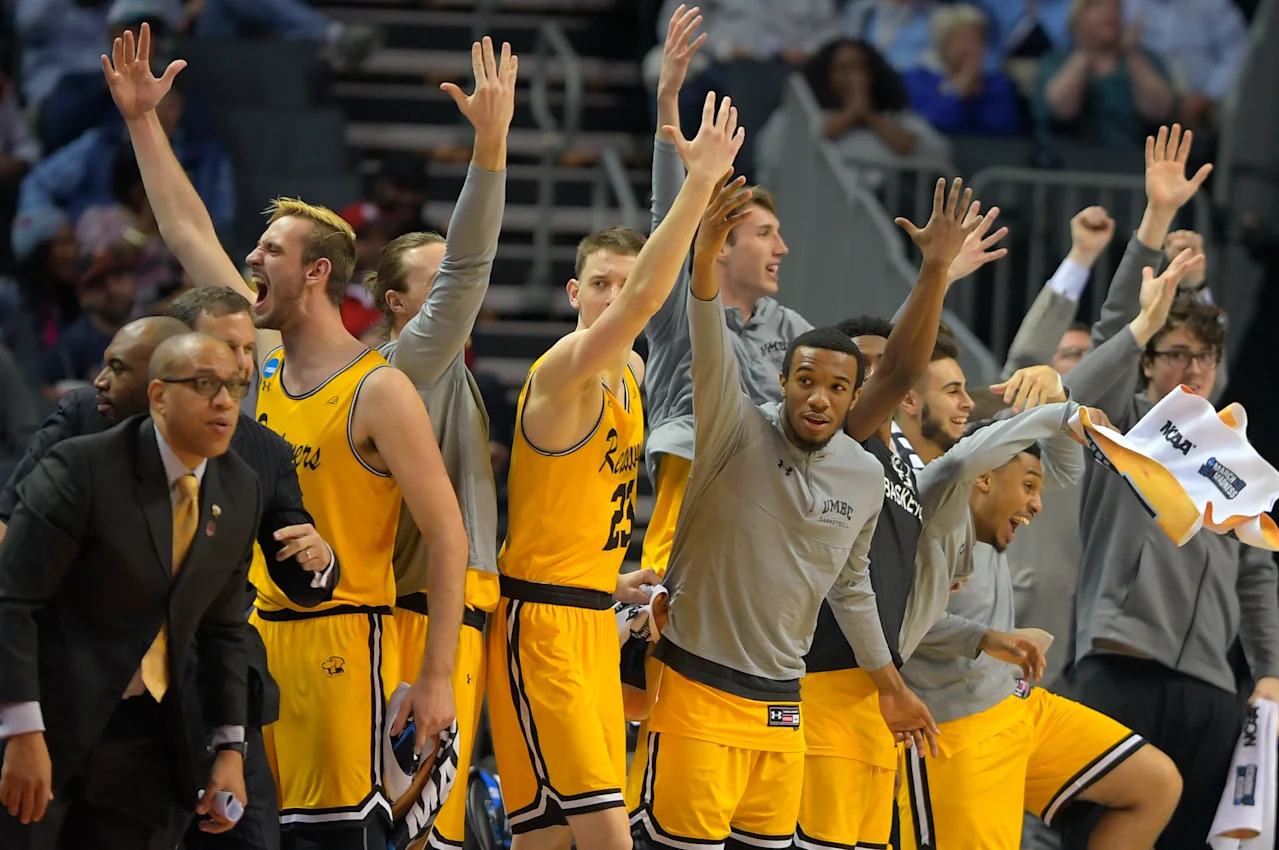 Charlotte NC - MARCH 16:   UMBC's bench erupts as they score a 2nd half basket pulling away during  UMBC's  upset of  the University of Virginia  in the 1st round for the mens NCAA basketball tournament at the Spectrum Center in Charlotte NC on March 16, 2018 . (Photo by John McDonnell/The Washington Post via Getty Images)