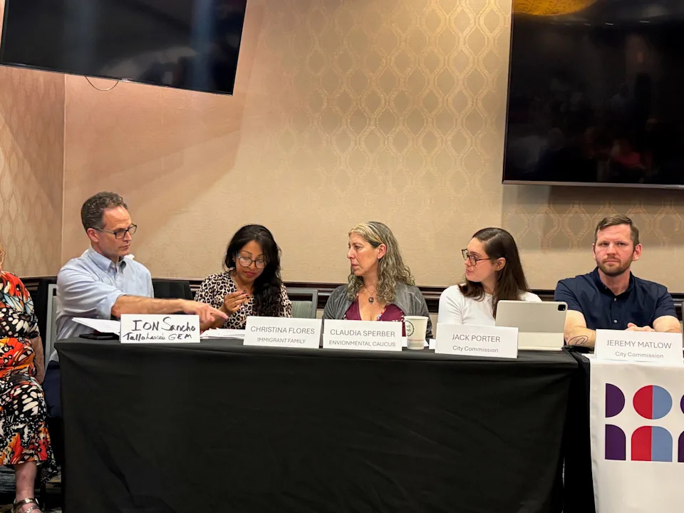 Christina Flores speaks about her husband's detainment at Indivisible panel.