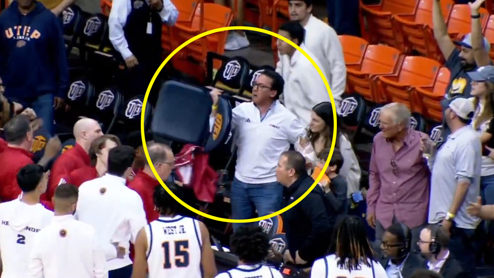 A fan holding a chair after UTEP-Jacksonville State game