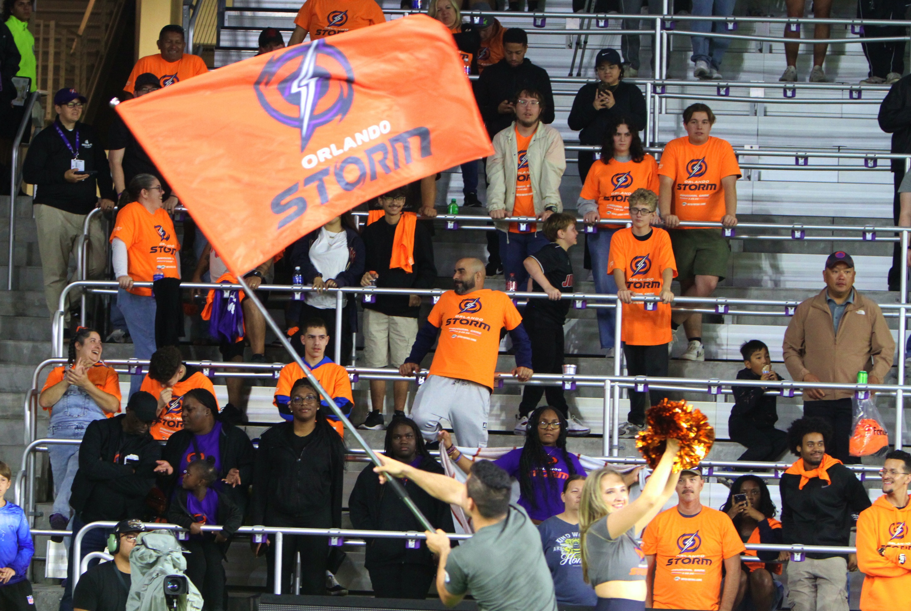 A yell leader waves the Orland Storm flag during the...