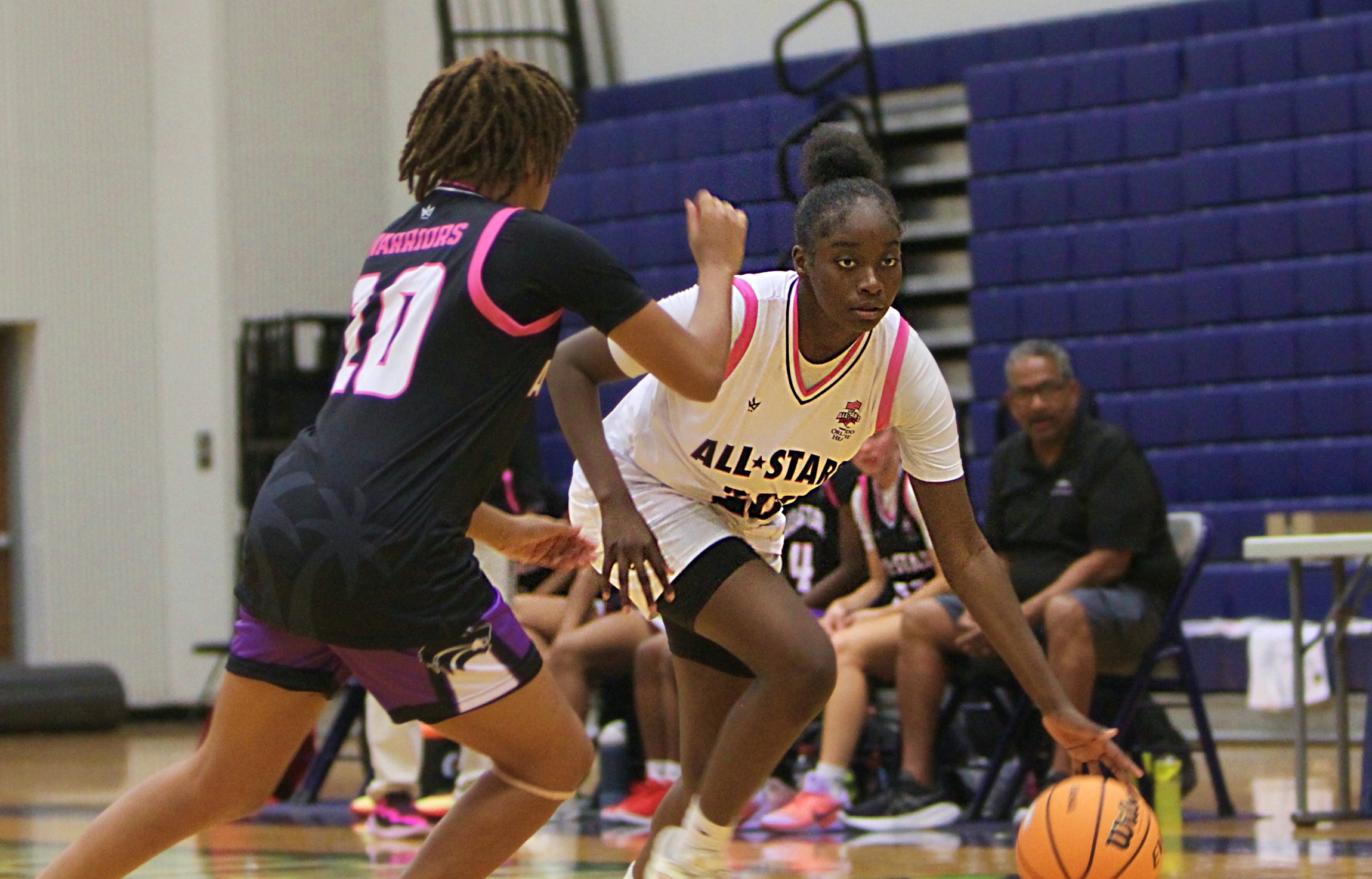 Gabby Fortius of Ocoee dribbles past Madison Prez of Timber...