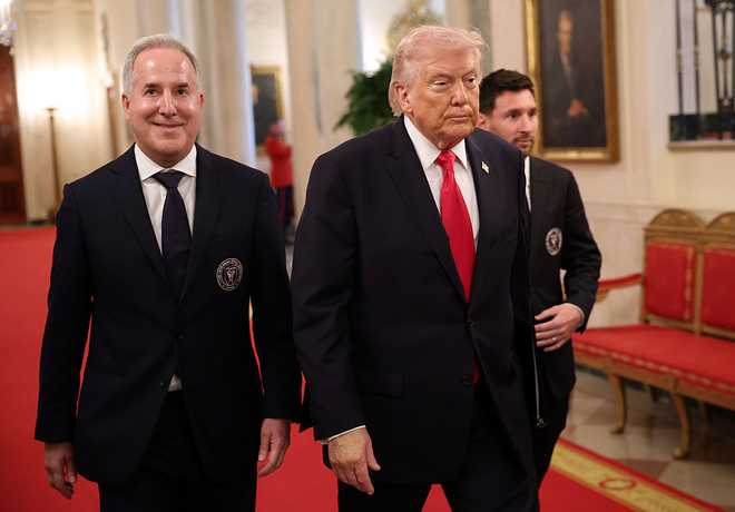 WASHINGTON, DC - MARCH 05: (L-R) Inter Miami CF CEO and Managing Owner Jorge Mas, U.S. President Donald Trump, and Lionel Messi of Inter Miami CF arrive for an event celebrating the 2025 MLS Cup Champions Inter Miami CF in the East Room of the White House on March 05, 2026 in Washington, DC. Inter Miami defeated the Vancouver Whitecaps 3-1 to win their first MLS Cup championship. (Photo by Win McNamee/Getty Images)