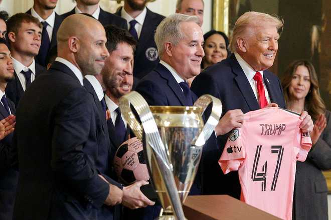 WASHINGTON, DC - MARCH 05: (L-R) Head Coach Javier Mascherano of the Inter Miami CF, Lionel Messi of Inter Miami CF, Inter Miami CF CEO and Managing Owner Jorge Mas, and U.S. President Donald Trump poses for photos during an event celebrating the 2025 MLS Cup Champions Inter Miami CF in the East Room of the White House on March 05, 2026 in Washington, DC. Inter Miami defeated the Vancouver Whitecaps 3-1 to win their first MLS Cup championship. (Photo by Alex Wong/Getty Images)