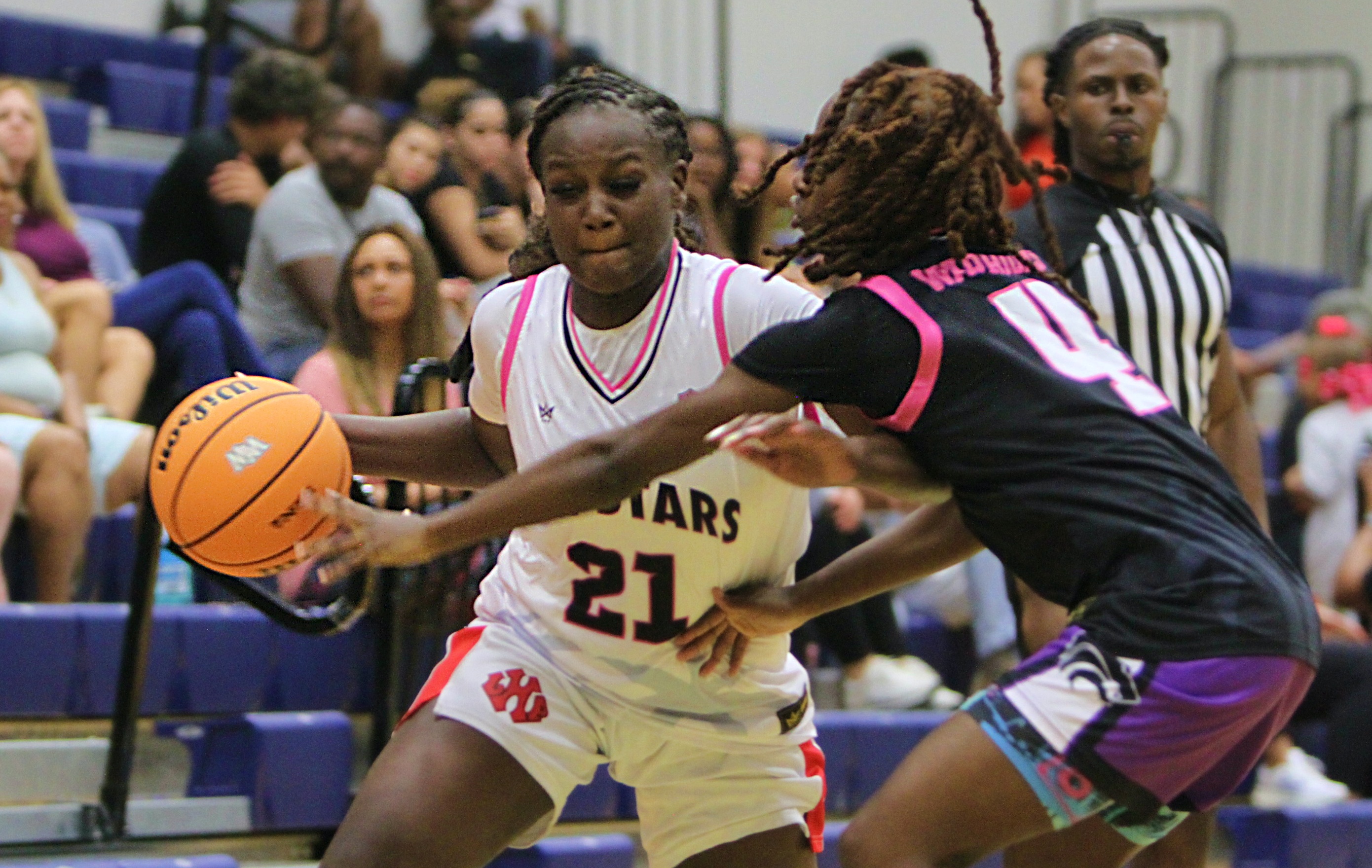Eryn Griffin (21) of Lake Highland Prep drives against Laila...