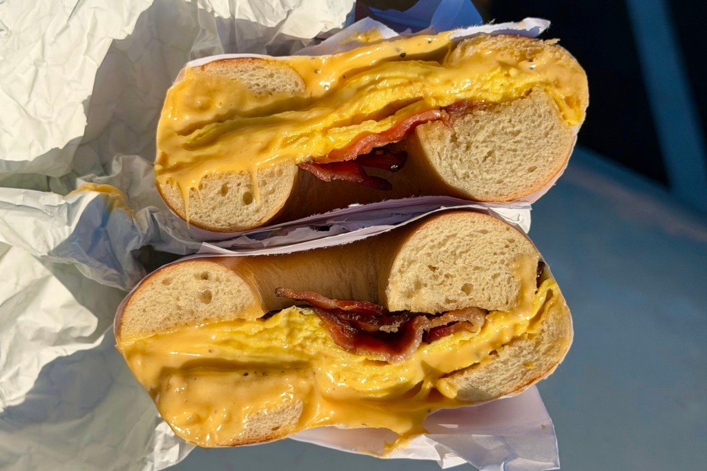 a delicious side shot of a bacon, egg, and cheese bagel