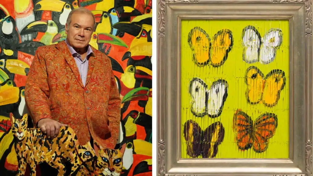 An artists next to sculpture, alongside a painting of butterflies