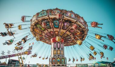 Photograph of people riding swing carousel