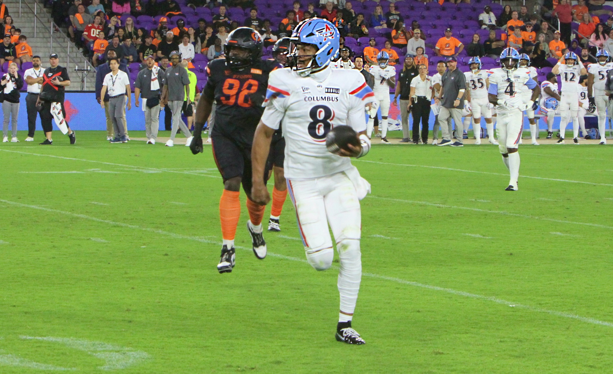 Columbus Aviators' quarterback Jalan McClendon runs toward the sideline during...