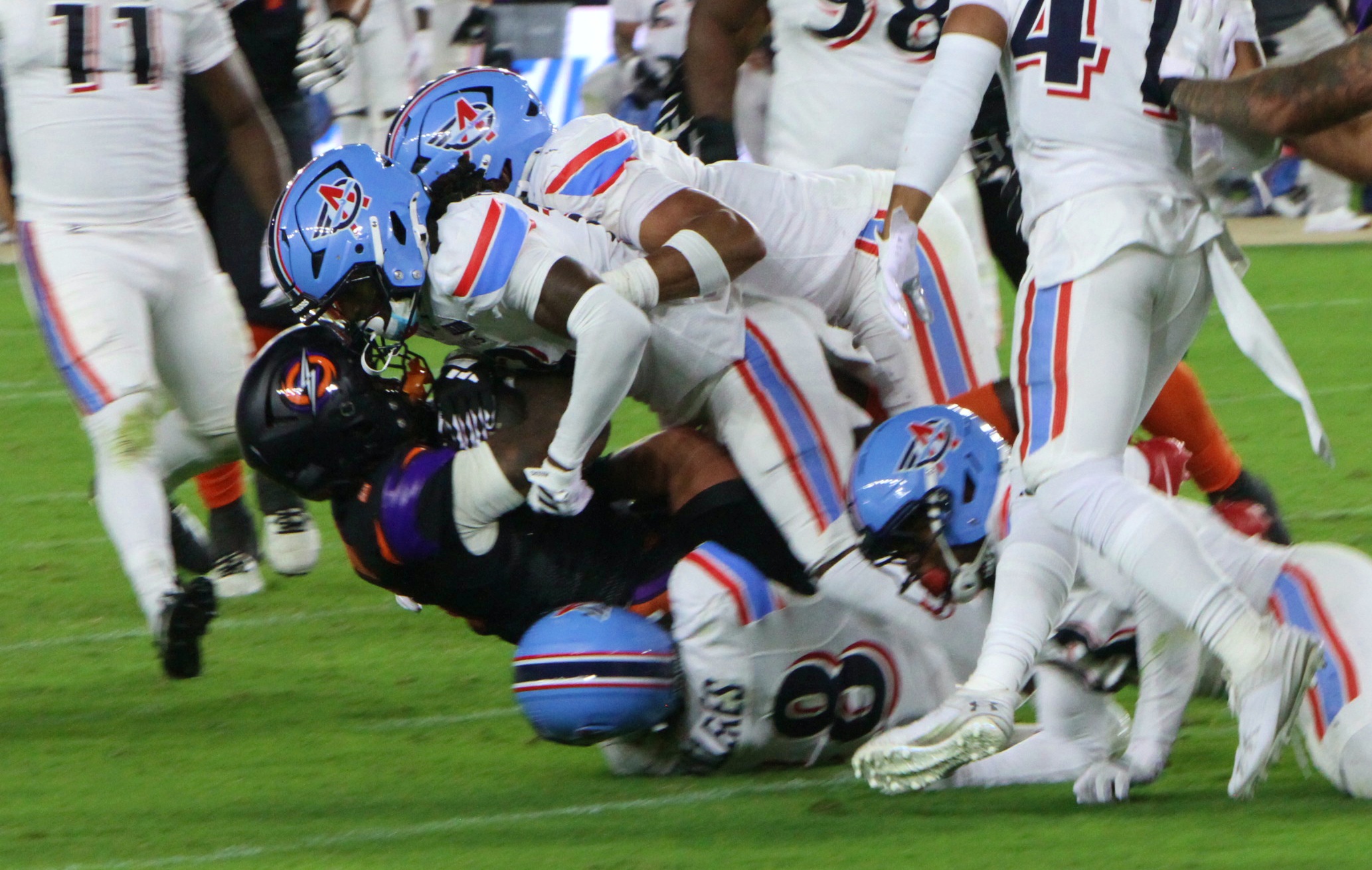 Orlando Storm running back Jashaun Corbin is tackled by a...