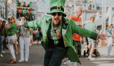 a man in all green wearing a leprechaun outfit at a St. Patrick's Day festival
