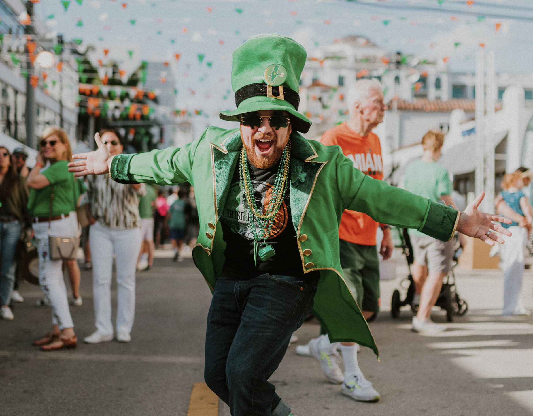a man in all green wearing a leprechaun outfit at a St. Patrick's Day festival