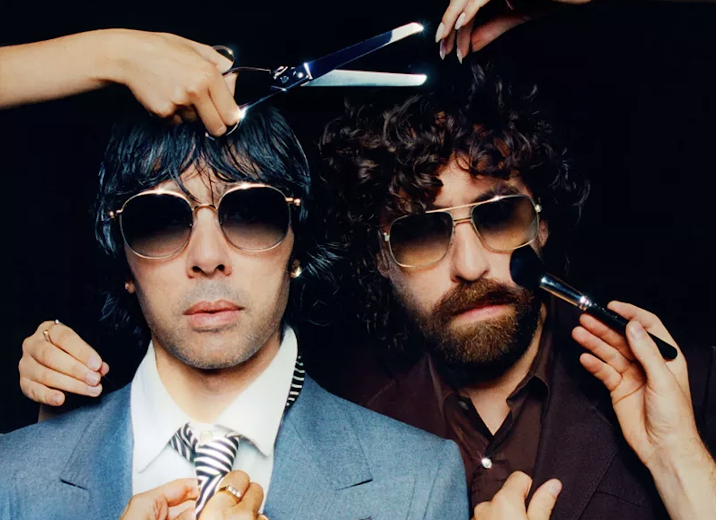 Photo of two men are putting on makeup and getting a haircut