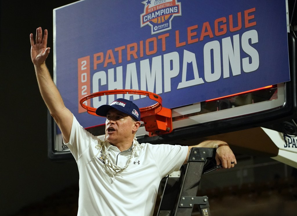 Lehigh Mountain Hawks head coach Brett Reed celebrates after winning the Patriot League Championship.