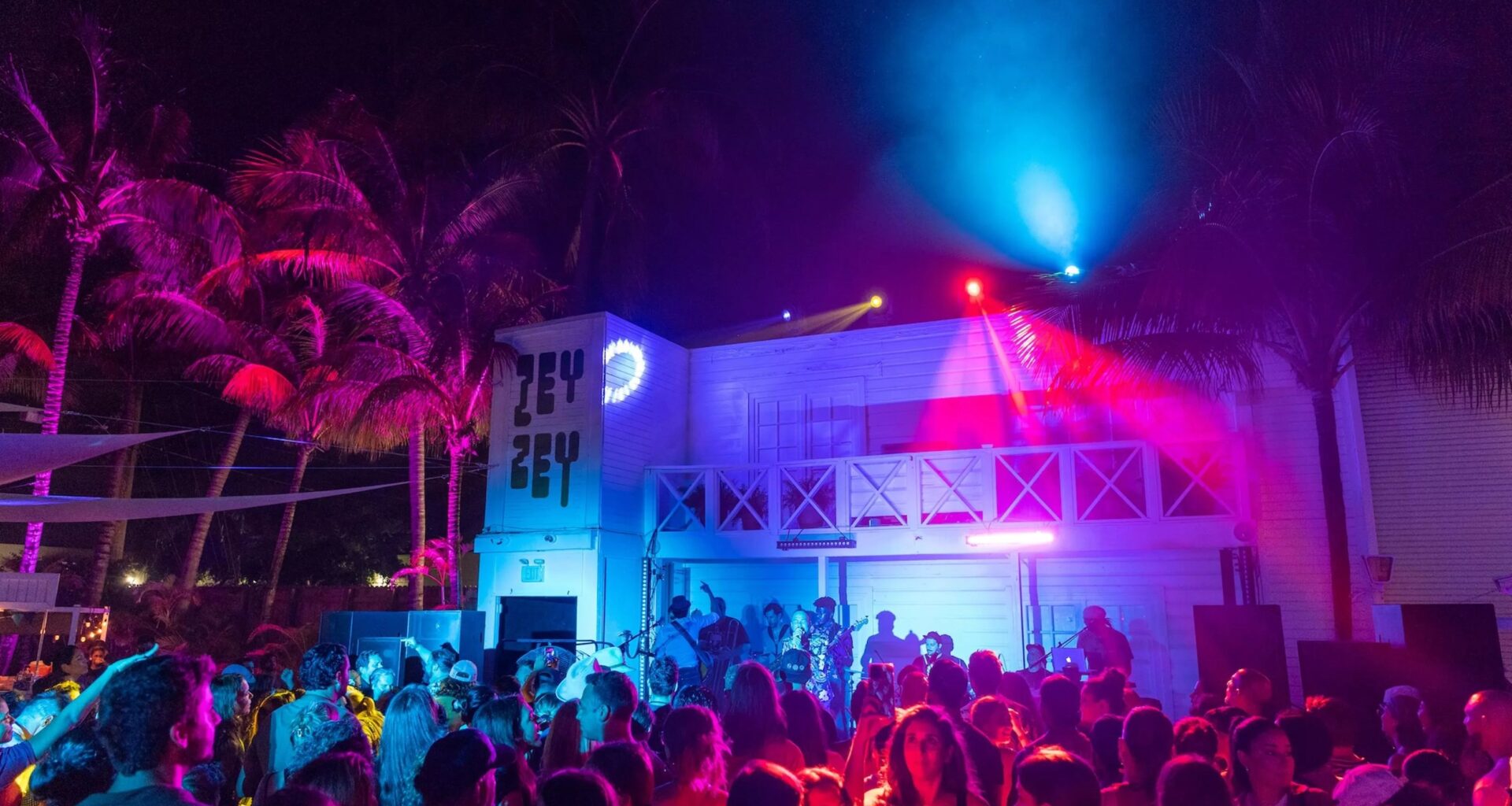 The crowd cheering on the band at ZeyZey