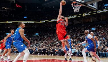 Toronto Raptors forward Sandro Mamukelashvili (54) scores between the Orlando Magic defense during first half NBA action in Toronto on Sunday, March 29, 2026. (Frank Gunn/The Canadian Press via AP)