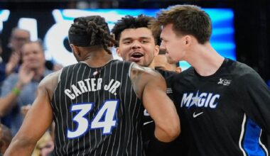Orlando Magic center Wendell Carter Jr. (34) celebrates with Noah Penda, center, and Colin Castleton after making the game winning shot against the Dallas Mavericks with 1.4 seconds left in an NBA basketball game, Thursday, March 5, 2026, in Orlando, Fla. (AP Photo/John Raoux)