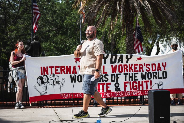 Brian Nathan, a U.S. Navy veteran from Tampa, walks in a parade. 