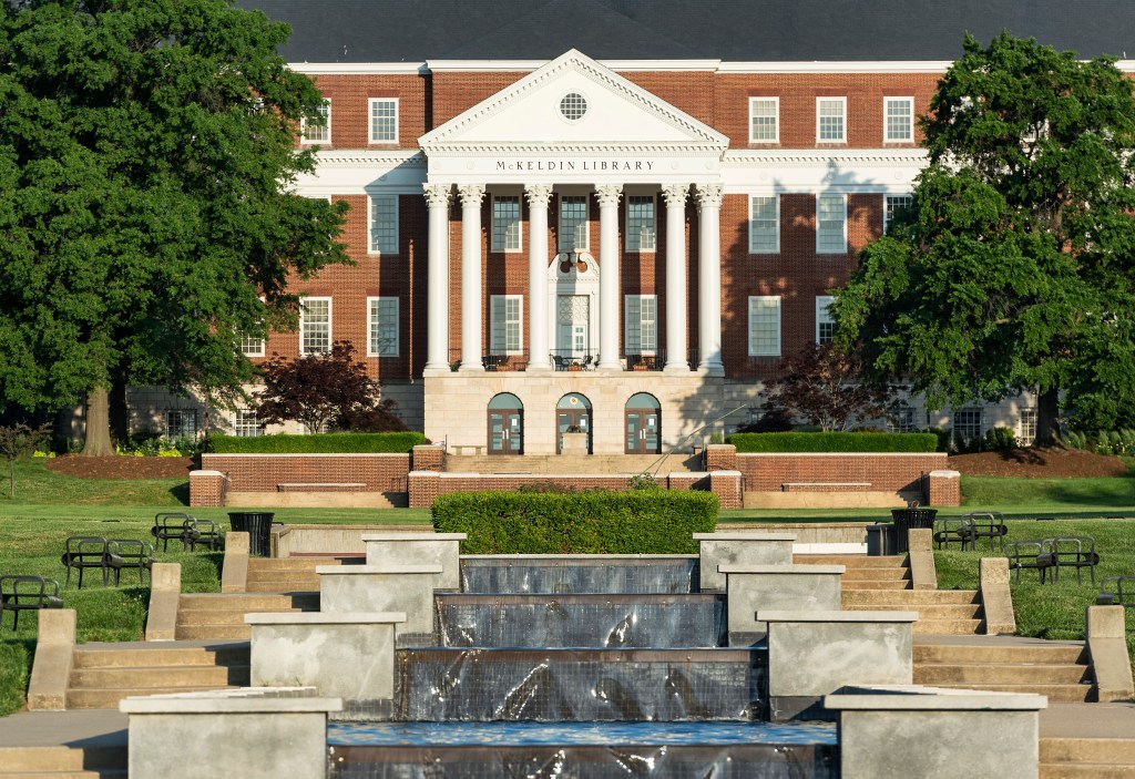 McKeldin Library, a brick building with white columns, and a terraced fountain on the campus of the University of Maryland.