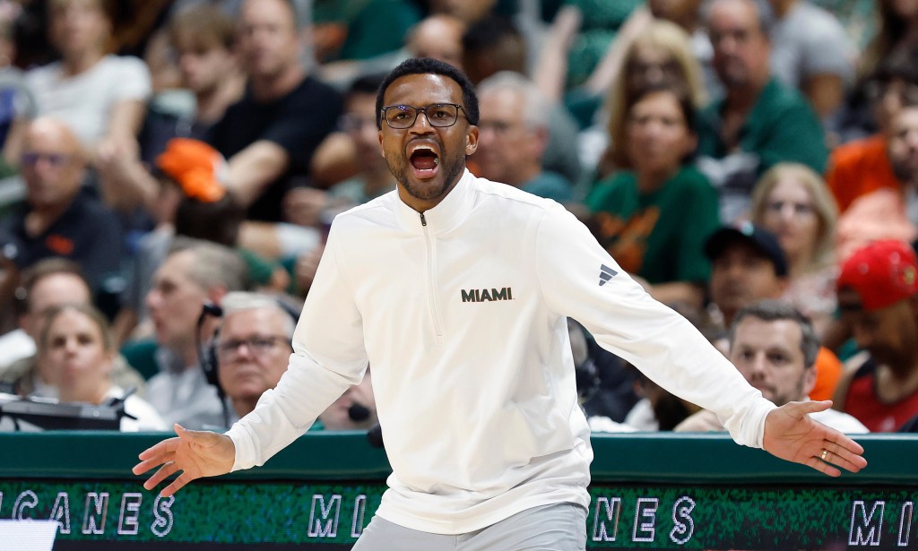 Miami head coach Jai Lucas reacts during an NCAA college basketball game.