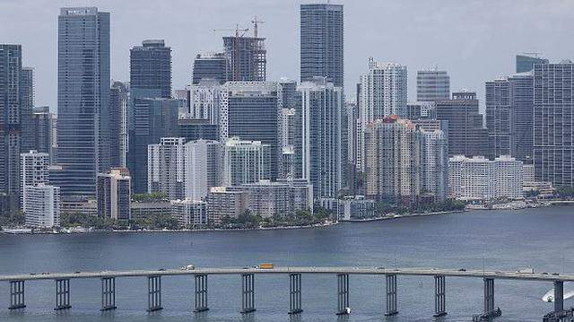 MIAMI, FLORIDA - JULY 21: An aerial view of the City of Miami skyline is seen next to the waters of Biscayne Bay on July 21, 2022 in Miami, Florida. Reports indicate that President Joe Biden is considering declaring a national climate emergency. The City of Miami and Miami Beach are expected to be profoundly impacted by rising sea levels due to climate change. A formal declaration of a national climate emergency would make it possible for the administration to use unilateral action by the executive branch to combat climate change. (Photo by Joe Raedle/Getty Images)