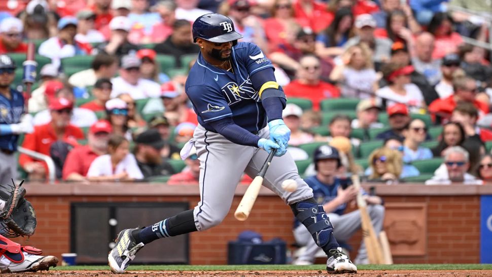 Tampa Bay Rays' Yandy Díaz hits an RBI single in the second inning of a baseball game against the St. Louis Cardinals, Sunday, March 29, 2026, in St. Louis. (AP Photo/Joe Puetz)