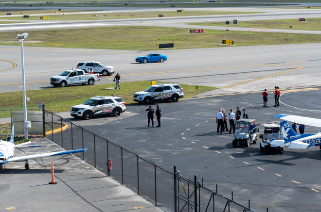 man drives through gate at central florida airport