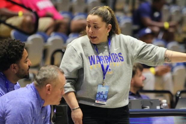 Orlando Christian Prep girls basketball coach Stephanee Velez talks to her assistant coaches on the bench during OCP's 71-36 loss to Grandview in the Class 1A state basketball championship game at UNF Arena in Jacksonville on Saturday, March 7, 2026. (Chris Hays/Orlando Sentinel)