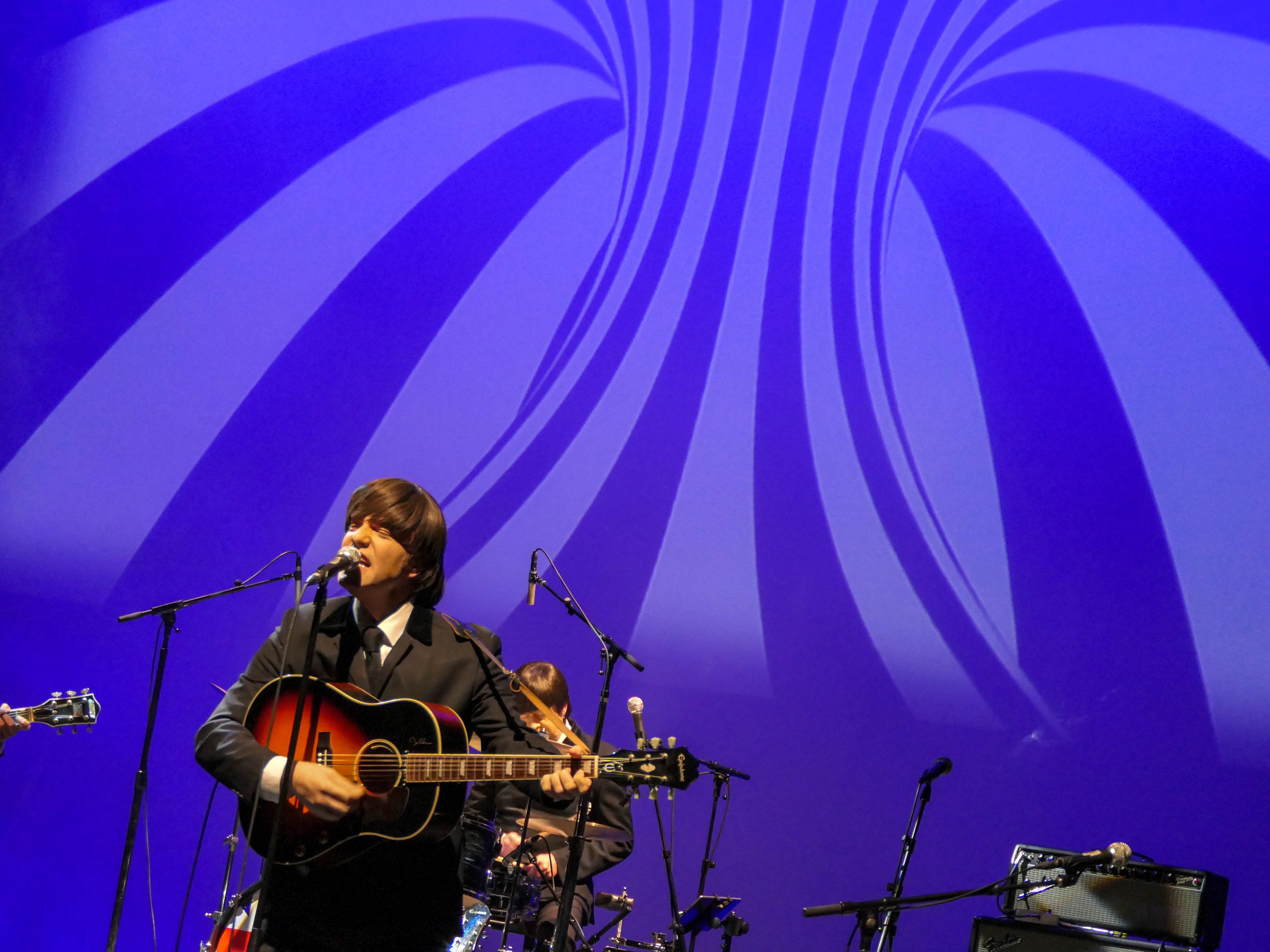 Abbey Road, portraying the Beatles, performs during the 