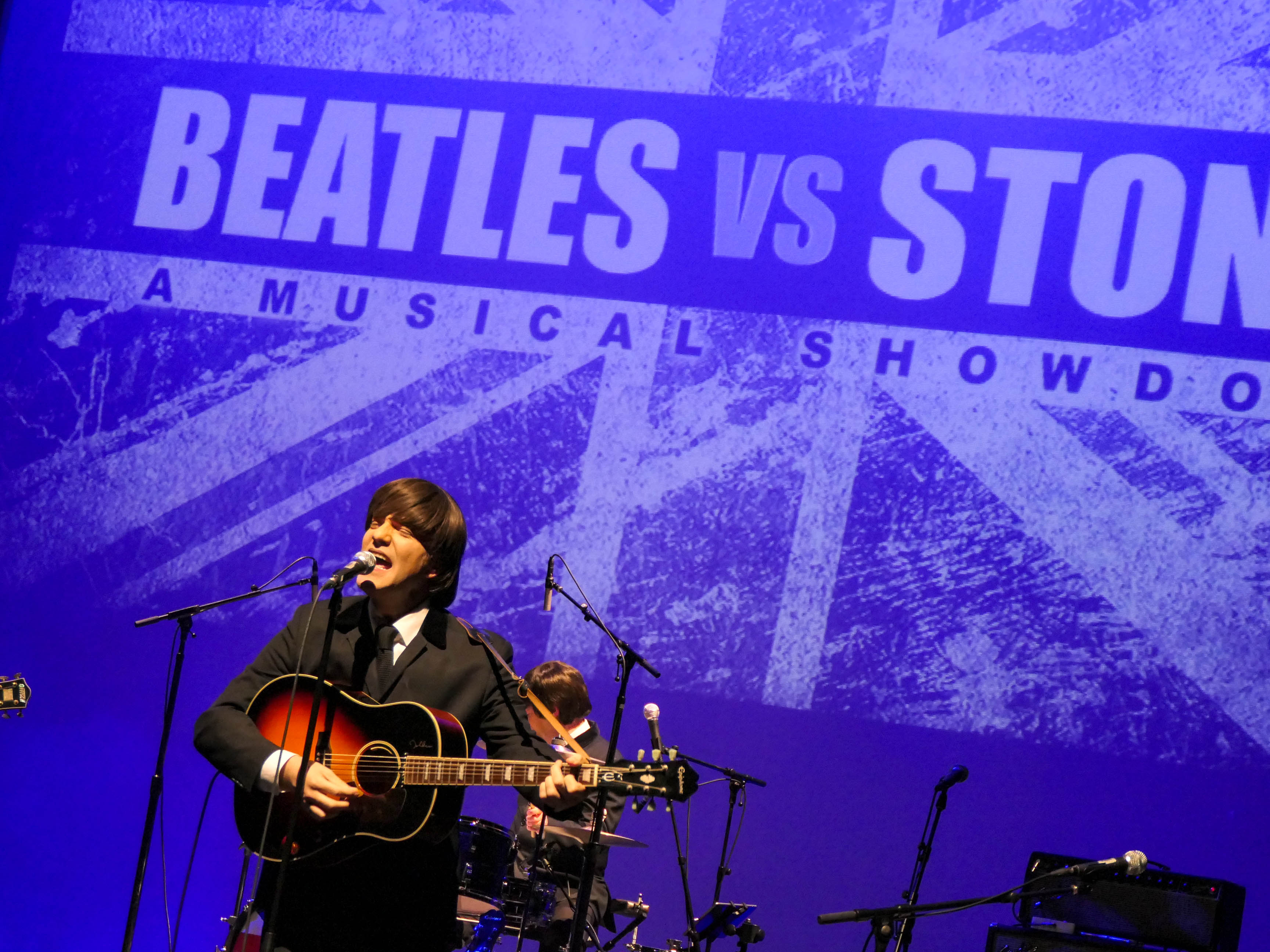 Abbey Road, portraying the Beatles, performs during the 